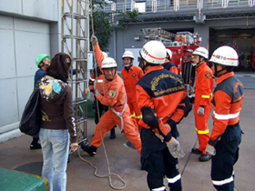 Instructors eagerly provide guidance, using ladders and other tools