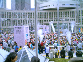 Runners start together under a blaze of confetti.